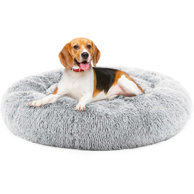 24 inch round fluffy plush faux fur pet bed with anti-slip bottom in grey with a dog laying on it