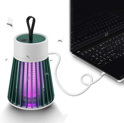 Electric mosquito killer lamp with USB connection, green and white design, attracting mosquitoes near a laptop.