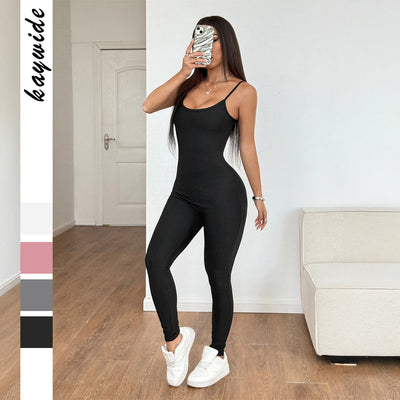 European and American style black sleeveless yoga jumpsuit with slim trousers in a minimalistic room setting.