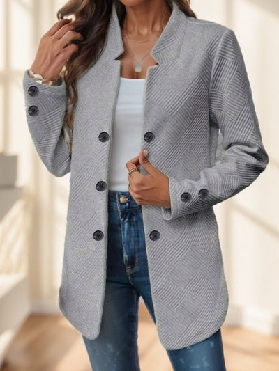 Plus size women's casual knit polyester jacket with double button detail and decorative pockets.