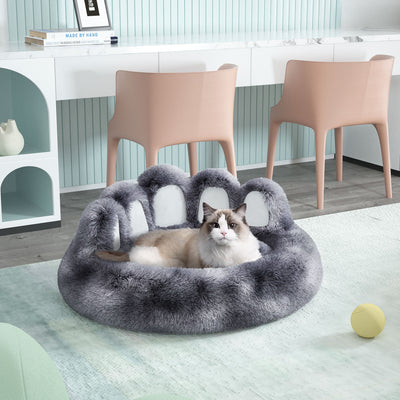 Cozy plush cute dog bed in gray bear paw shape for small and medium pets with a cat lying inside