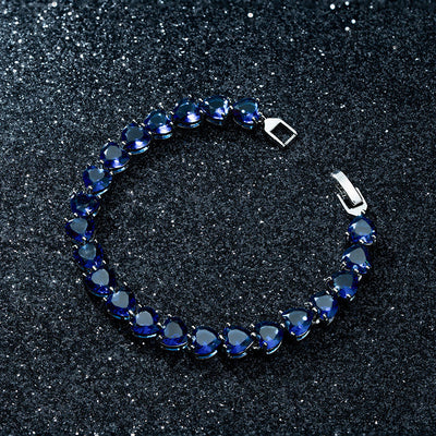 Blue heart-shaped zircon bracelet with platinum-plated copper, luxury women's accessory.