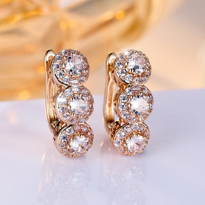 Full Rhinestone Zircon three-round ear clip in champagne gold with white diamonds.