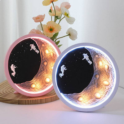 Moon astronaut wireless Bluetooth speaker with LED lights and decorative design for home use.