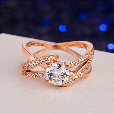 Rose gold plated diamond-studded geometric ring on display.