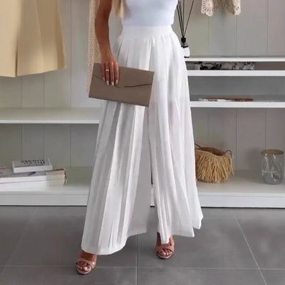 Women's solid color casual loose pleated white skirt in mid-length A-line style.