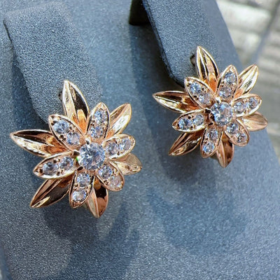 Gold copper earrings with flower design, electroplated for a delicate, fashionable jewelry look.