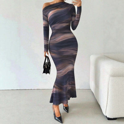 Tie-dyed crossbody shoulder asymmetric fold dress with long sleeves in abstract pattern.