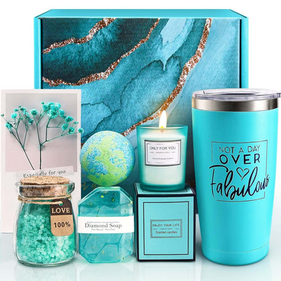 Relaxing spa gift basket set with insulated tumbler, scented candle, bath bomb, bath salt, diamond soap, and greeting card in turquoise packaging